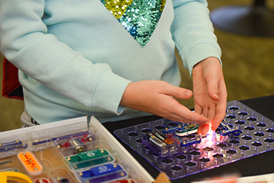 Hands working with circuit